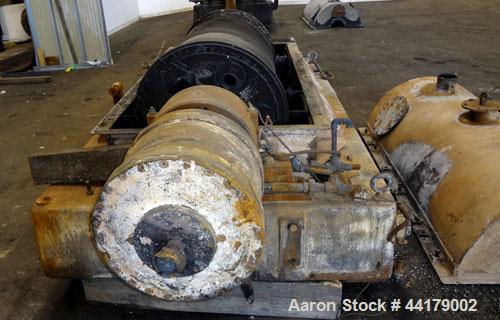 Used Sharples P-5000 Super-D-Canter Centrifuge. 316 Stainless steel product contact areas. Maximum bowl speed 3000 rpm. 5" Pitch conveyor, base, casing, cover, and feed pipe.