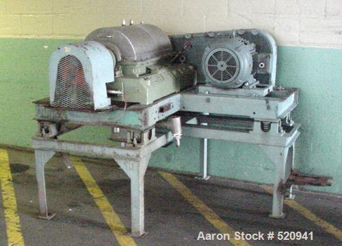 USED: Sharples P2000 centrifuge, stainless steel contact parts,rated at 3180 G's at 4000 rpm, vane pitch is 2", 15 hp drive with165:1 gear ratio. Mounted on a base with vibration isolators.