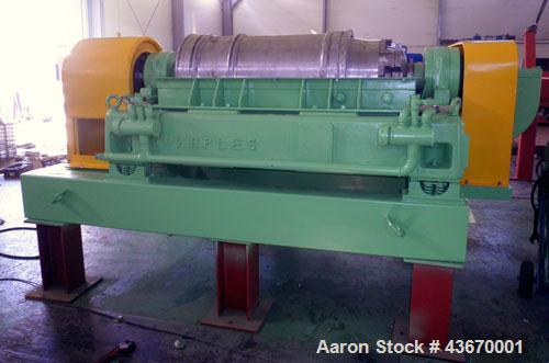 Used Sharples P-4600 Super-D-Canter Centrifuge, 316 stainless steel construction. Single lead conveyor with hardfacing, hogged-out cake port with replaceable wear liner, gearbox, base, casing.