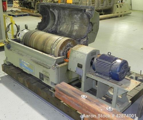 Used Sharples PM-35000 (Type RR-392) Super-D-Canter Centrifuge System. Driven by a 30 HP, 3/60/460 Volt, 1755 RPM motor. 10 HP backdrive motor. Includes a control panel with an Allen Bradley Panelvie...