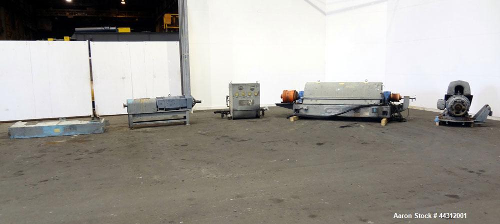 Used Sharples PM-55000 Super-D-Canter Centrifuge. 317 Stainless steel construction (product contact areas), 8” single lead quasi-axial conveyor with STC wear protection tiles, 360 degree solids disch...