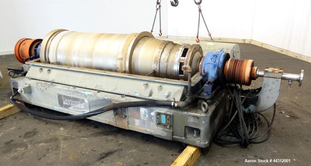 Used Sharples PM-55000 Super-D-Canter Centrifuge. 317 Stainless steel construction (product contact areas), 8” single lead quasi-axial conveyor with STC wear protection tiles, 360 degree solids disch...
