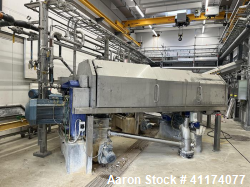 Used Alfa Laval DSNX 4850 Decanter Centrifuge. Stainless steel (product contact areas). Max bowl speed 3650 rpm, 2 phase separation (liquid/solids) design. Bowl dia: 480/263 mm (18.7/10.2), Bowl beach angle: 10°, 250 mm (10") pitch, conveyor flights are protected with around 200 tungsten carbide tiles, single row of 360 deg lined cake solids discharge ports, base, casing, gearbox 6 kNm, back drive 1:169 and Alfa Laval control panel with ABC controller. Previously used in a Medical WWT applicati