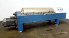 Used Alfa Laval DSNX-4850 Solid Bowl Decanter Centrifuge.  AISI 316 (1.4401) Stainless steel construction on product contact parts.  Max bowl speed 3650 rpm, 2 phase, 18.8