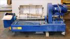 Used Alfa Laval NX-414B-31 Solid Bowl Decanter Centrifuge, 316 stainless steel (product contact areas). Max bowl speed 4000 rpm, single row of cake solids discharge ports, 2.75