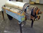 Used Alfa Laval NX-418 (2 or 3 phase) Solid Bowl Decanter Centrifuge. 316 Stainless steel construction (product contact areas), maximum bowl speed 3250 rpm, single row of lined cake discharge ports, ...