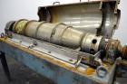 Used Alfa Laval NX-418 (2 or 3 phase) Solid Bowl Decanter Centrifuge. 316 Stainless steel construction (product contact areas), maximum bowl speed 3250 rpm, single row of lined cake discharge ports, ...