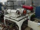 USED: Sharples P-660 Super-D-Canter centrifuge, 316 stainless steel construction on product contact areas. 5 hp main drive, 3 hp back drive, 95:1 gearbox, mounted on table with vibration isolators.