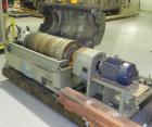 Used Sharples PM-35000 (Type RR-392) Super-D-Canter Centrifuge System. Driven by a 30 HP, 3/60/460 Volt, 1755 RPM motor. 10 HP backdrive motor. Includes a control panel with an Allen Bradley Panelvie...