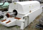 Used Sharples PM-85000 Super-D-Canter Centrifuge, 316 Stainless Steel Construction on Product Contact Areas. Max bowl speed 2345 RPM, sintered tungsten carbide lined beach section, 12