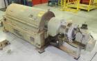 Used Sharples PM30000 Decanter Centrifuge, Type PR264/10 484720, 316 Stainless Steel. Driven by a 30 HP, 3/60/575 Volt, 1755 RPM motor. Includes drive & a control panel.