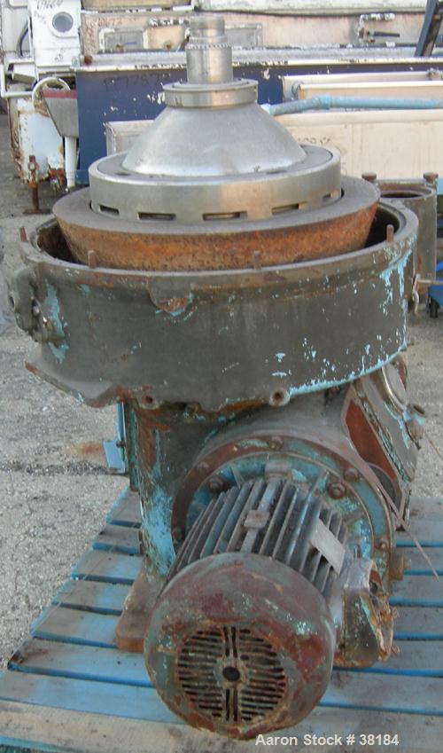 USED: Alfa-Laval AFPX-309-74B desludger centrifuge, 316 stainless steel, separator top feed. Driven by a 30 kw, 3/50/400/440 volt, 1445 rpm direct drive motor. Mounted on a carbon steel base.