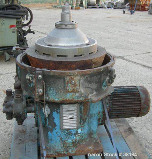 USED: Alfa-Laval AFPX-309-74B desludger centrifuge, 316 stainless steel, separator top feed. Driven by a 30 kw, 3/50/400/440 volt, 1445 rpm direct drive motor. Mounted on a carbon steel base.