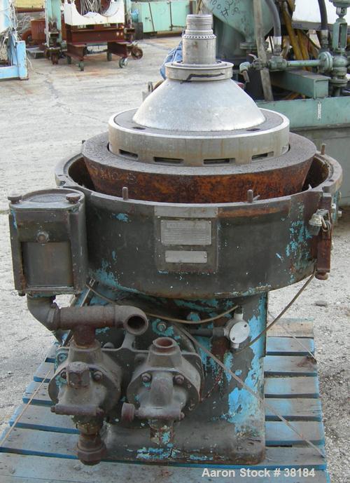 USED: Alfa-Laval AFPX-309-74B desludger centrifuge, 316 stainless steel, separator top feed. Driven by a 30 kw, 3/50/400/440 volt, 1445 rpm direct drive motor. Mounted on a carbon steel base.