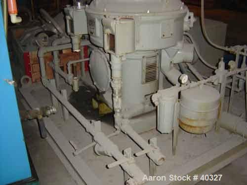 USED: Alfa-Laval AFPX-309B-74-60 desludger centrifuge, 316 SS,separator design, top feed, 15 hp 220/440/3/60, direct drive, skidmounted, controls.