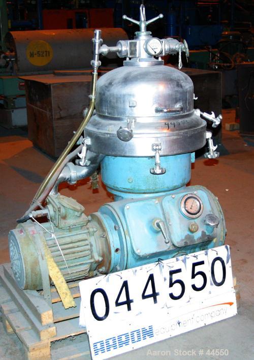 USED: Alfa Laval desludger disc centrifuge, model BRPX207-SGV-34.  316 stainless steel on product contact areas, clarifier design. Water harness, approx 7.5 hp motor (no tag), mounted on a sub-base.