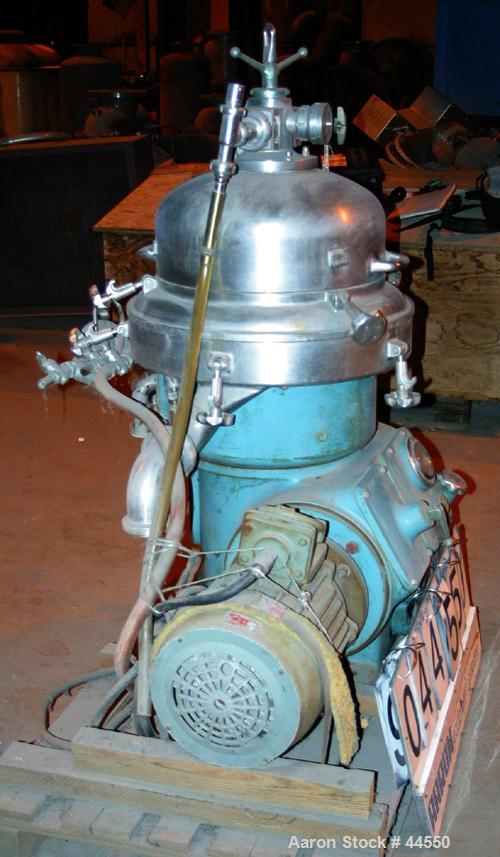 USED: Alfa Laval desludger disc centrifuge, model BRPX207-SGV-34.  316 stainless steel on product contact areas, clarifier design. Water harness, approx 7.5 hp motor (no tag), mounted on a sub-base.