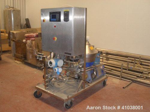 Used Alfa Laval WSPX-404-SGP-31G Desludger Disc Centrifuge. Stainless steel construction, clarifier design, centripetal pump liquid discharge, belt drive configuration, PLC control, mounted on cart.