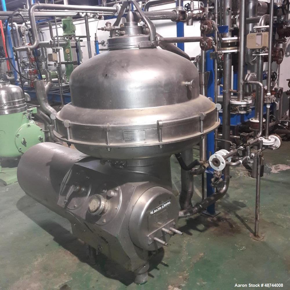 Used Alfa Laval SRPX-417 HGV-14CH Desludger Disc Centrifuge. 316 Stainless steel construction (product contact areas), separator design liquid/liquid/solids. Bottom feed design, flange drive motor, 1...