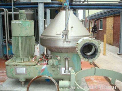 Used Westfalia SA 100-33-777 Desludger Centrifuge, stainless steel, with self-cleaning disc and a 60 hp/45 kW belt drive at approximately 4000 rpm. Size 6.6' x 6.6' x 6.2' (2000 mm x 2000 mm x 1900 m...