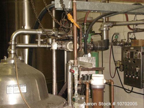 Used Westfalia SA-80-06-177 Desludger Disc Centrifuge. 316 stainless steel construction (product contact areas), clarifier design, centripetal pump liquid discharge, lube system, belt drive configura...