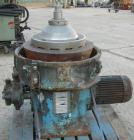 USED: Alfa-Laval AFPX-309-74B desludger centrifuge, 316 stainless steel, separator top feed. Driven by a 30 kw, 3/50/400/440 volt, 1445 rpm direct drive motor. Mounted on a carbon steel base.