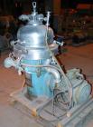 USED: Alfa Laval desludger disc centrifuge, model BRPX207-SGV-34.  316 stainless steel on product contact areas, clarifier design. Water harness, approx 7.5 hp motor (no tag), mounted on a sub-base.