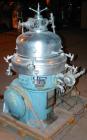 USED: Alfa Laval desludger disc centrifuge, model BRPX207-SGV-34.  316 stainless steel on product contact areas, clarifier design. Water harness, approx 7.5 hp motor (no tag), mounted on a sub-base.