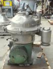 Used Westfalia Disc Centrifuge, Model SAMN-5036, 329 stainless steel. Maximum bowl speed 6500 rpm, centripetal pump liquid discharge. Direct driven by an approximately 20 hp motor.