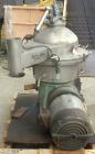 Used Westfalia Disc Centrifuge, Model SAMN-5036, 329 stainless steel. Maximum bowl speed 6500 rpm, centripetal pump liquid discharge. Direct driven by an approximately 20 hp motor.