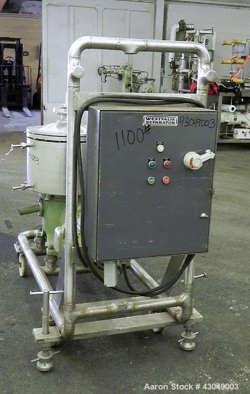 Used Westfalia BKA-6-86-076 Solid Bowl Disc Centrifuge, 316 Stainless Steel. Maximum bowl speed 8510 rpm, direct drive configuration, 7.5 hp drive motor. Mounted on a cart with casters and a control ...