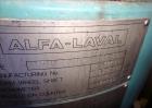 Used Alfa-Laval BTUX-51OT-34CEP-60 Nozzle Disc Centrifuge, 316 stainless Steel (product contact areas), clarifier design (Liquid/solids separation), centripetal pump liquid discharge, driven by a 45 ...