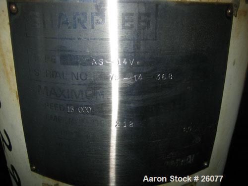 Used Sharples AS14V Super Centrifuge. 316 stainless steel bowl and covers. Maximum bowl speed 15,000 rpm. Front drag assembly. Requires motor
