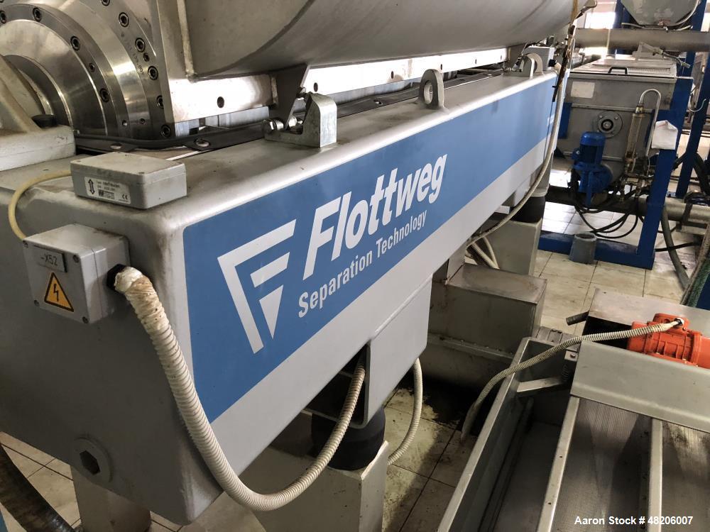 Used Flottweg Z4E-4/444H Tricanter Solid Bowl Decanter Centrifuge. Maximum bowl speed 3500 rpm, three phase separation (liquid/liquid/solids separation), bowl, conveyor, base, casing, feed pipe, grea...