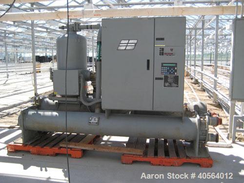 Used Dunham Busch, model WCFFX12BAS, 30 ton capacity glycol chiller. Uses R-22 refrigerant, skid mounted with 6 ft long x 4 ft wide x 6 ft high rectangular open top water storage tank.  Compressor ra...