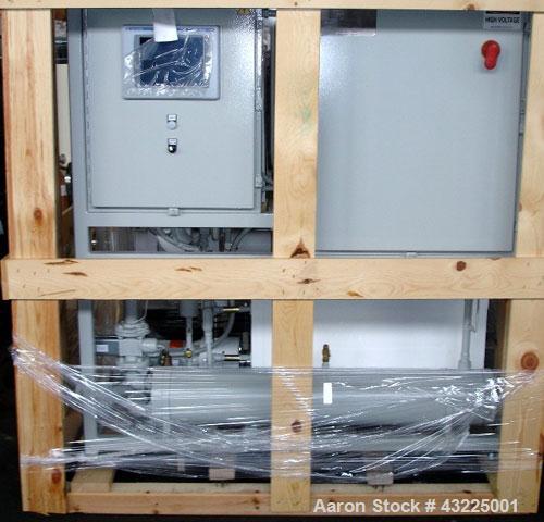 Unused- Budzar 15 Ton Water Cooled Chiller, Model LTW-15-FCB-70-S2S1. Nominally rated 70 gpm at 90' tdh. (2) Compressors, 5 hp circulation pump, condenser and plate heat exchanger, 65 gallon stainles...
