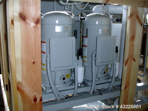 Unused- Budzar 15 Ton Water Cooled Chiller, Model LTW-15-FCB-70-S2S1. Nominally rated 70 gpm at 90' tdh. (2) Compressors, 5 hp circulation pump, condenser and plate heat exchanger, 65 gallon stainles...