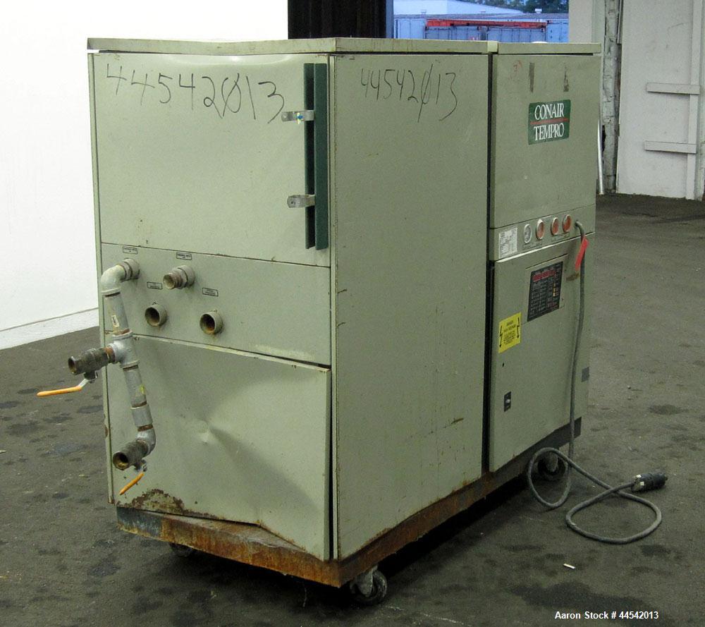 Used Conair Tempro Chiller, Model WC3-5, Approximately 5.8 tons. Water cooled. Temperature range 20 to 65 degrees F. Includes Micro Trac 3 control panel. Mounted on casters. 
.