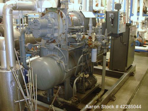 Used FES Rotary Screw Chiller, 40 Tons. Water cooled, single compressor with heat exchanger. Price includes 15% buyer's premium.