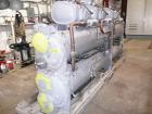 Unused-Slightly Damaged Carrier Model 30HXC246R--650--, Nominal 246 Ton, Water Cooled Screw Chiller. Designed for 460/3/60 volt operation and originally manufactured in 2003. The approximate unit dim...