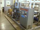 Used FES Rotary Screw Chiller, 40 Tons. Water cooled, single compressor with heat exchanger. Price includes 15% buyer's premium.