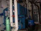USED: TECO 300 ton chiller, natural gas driven, water cooled. Two compressors: engine A has 2143 hours, engine B has 2500 hours. Includes flat bed trailer it is sitting on.