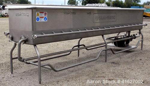 Used Sani-Matic Horizontal C.O.P. Tank, Model RW-12-10-N-NE-1, Approximate 275 Gallon, 304 Stainless Steel. Tank measures approximately 146" long x 24" wide x 21" deep. 2 1/2" sanitary bottom outlet....