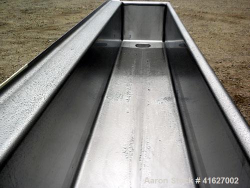 Used Sani-Matic Horizontal C.O.P. Tank, Model RW-12-10-N-NE-1, Approximate 275 Gallon, 304 Stainless Steel. Tank measures approximately 146" long x 24" wide x 21" deep. 2 1/2" sanitary bottom outlet....