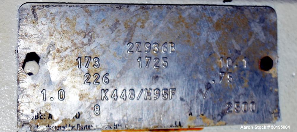 Used Coating Drum, Stainless Steel. Perforated drum approximate 23" diameter x 96" long, driven by an approximate 0.75hp gear motor. Top end feed hopper with a screw feeder driven by a 0.37kw gear mo...