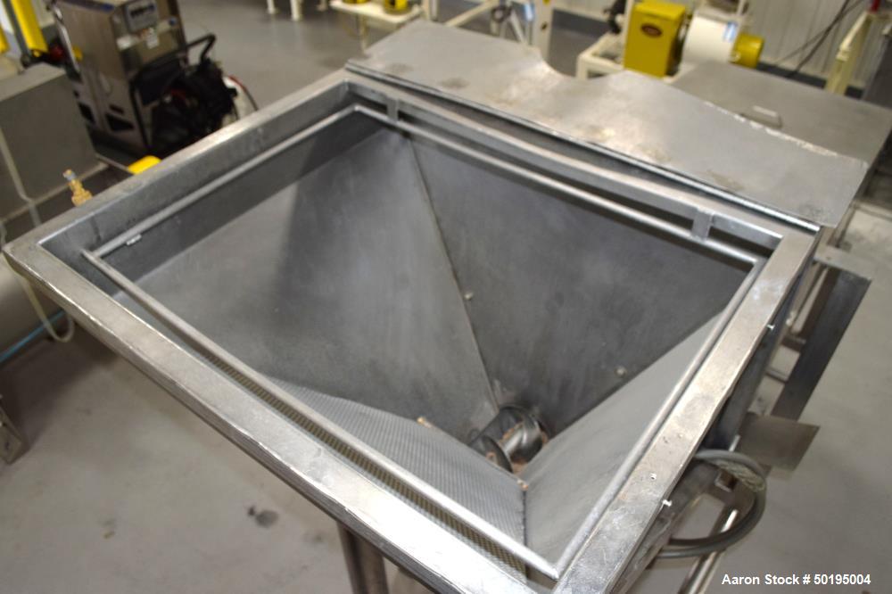 Used Coating Drum, Stainless Steel. Perforated drum approximate 23" diameter x 96" long, driven by an approximate 0.75hp gear motor. Top end feed hopper with a screw feeder driven by a 0.37kw gear mo...