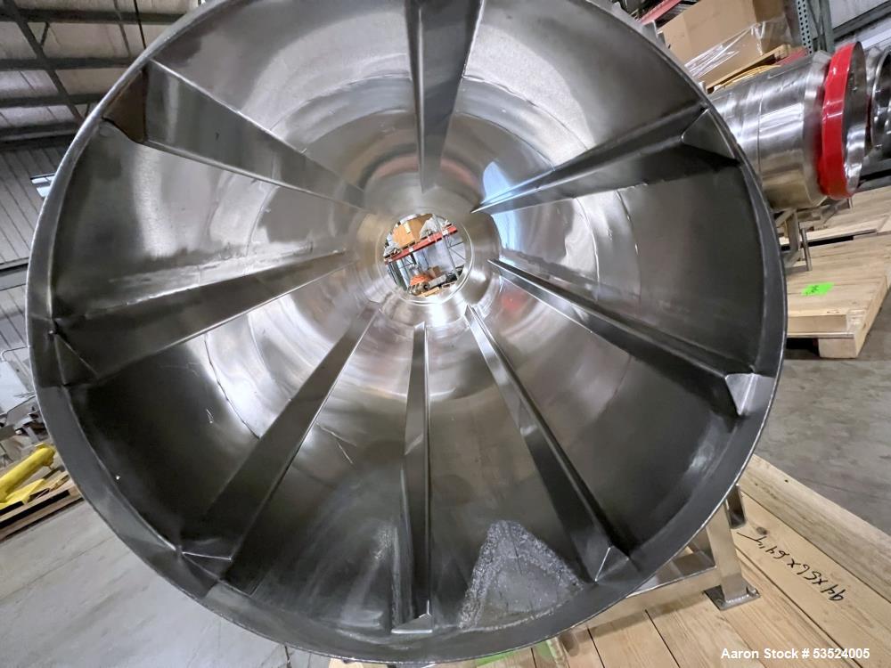 Used Stainless Steel Seasoning Drum. Approximate 30" diameter x 64" long. (8) Internal flights. Has adjustable pitch. 20" Inlet, 26" outlet. Driven by 1/2hp, 90 volt, 1750 rpm motor. Control panel. M...