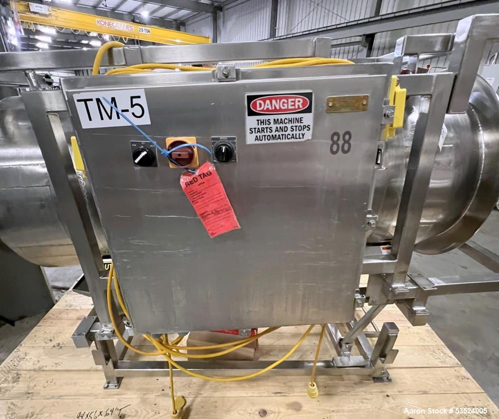 Used Stainless Steel Seasoning Drum. Approximate 30" diameter x 64" long. (8) Internal flights. Has adjustable pitch. 20" Inlet, 26" outlet. Driven by 1/2hp, 90 volt, 1750 rpm motor. Control panel. M...