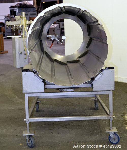 Used Spray Dynamite Rotary Drum Tumbler/Liquid Applicator, 304 Stainless Steel. 30" Diameter x 65" long horizontal drum with flights and lifters. 22-3/4" Diameter end feed opening with a 2" diameter ...