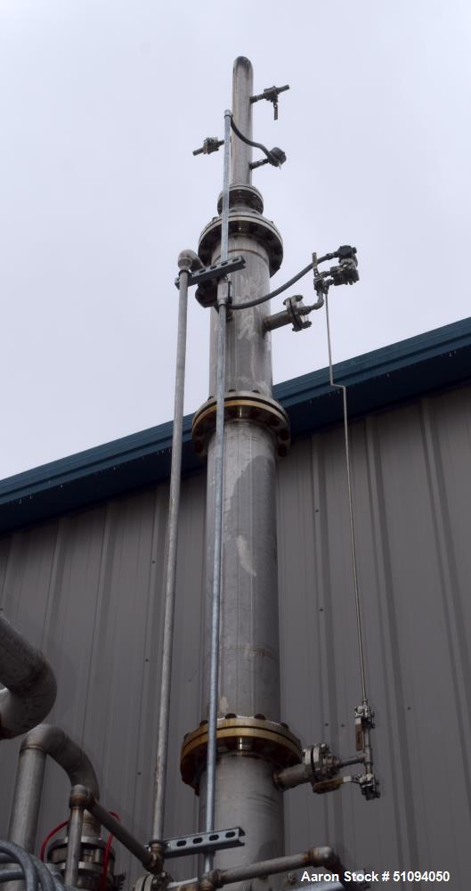 Used- Scrubber Column, Stainless Steel, Vertical. (3) Bolt together sections approximate 10" diameter x 20' tall.